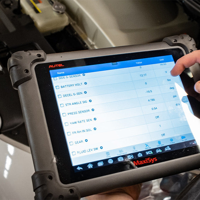 Car fault diagnosis using Autel scanner in a repair shop