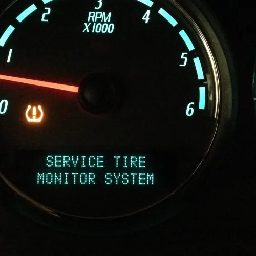 The tpms light appears on the car's dashboard and needs to be reset.