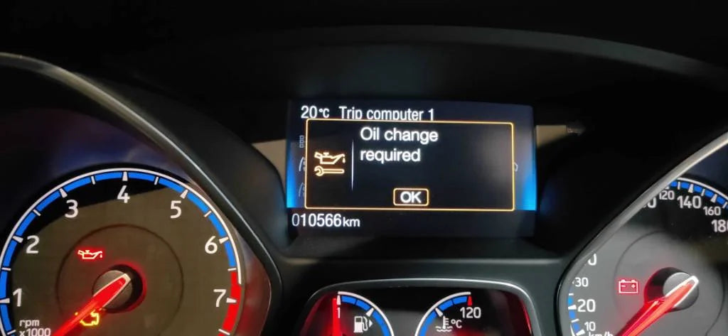 The oil change light appears on the car dashboard.