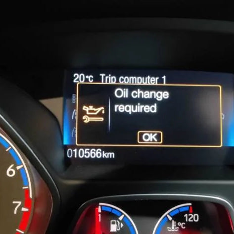 The oil change light appears on the car dashboard.